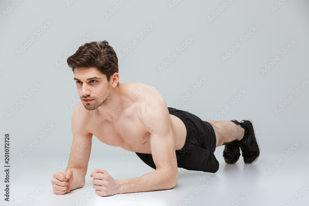 Fototapeta premium Portrait of a concentrated young half naked sportsman