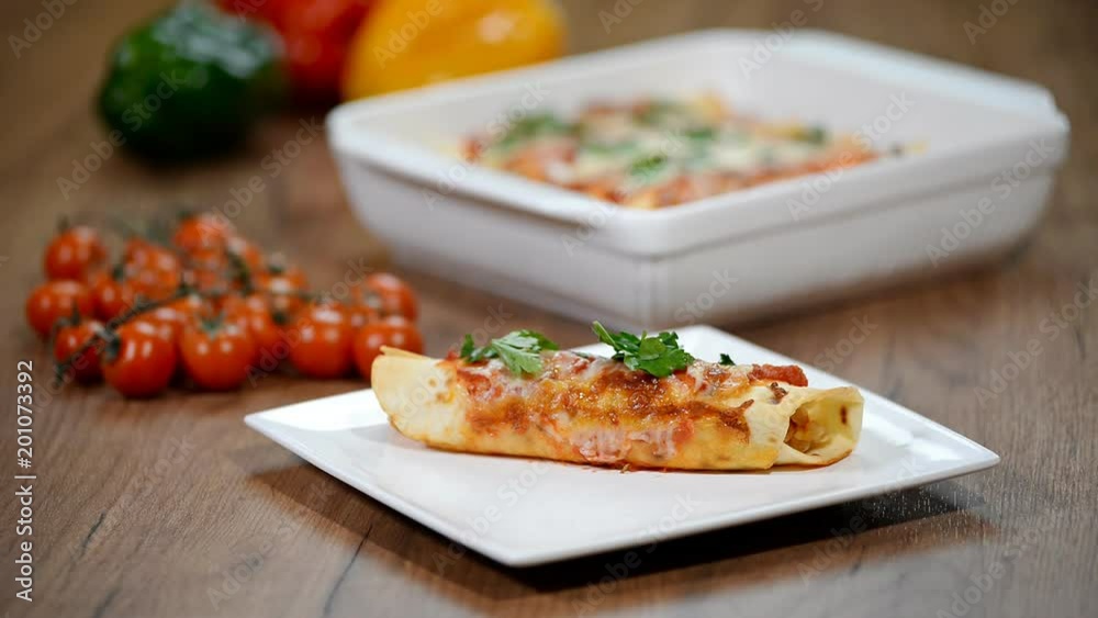 Homemade chicken enchiladas in a white plate Homemade chicken enchiladas in a white plate