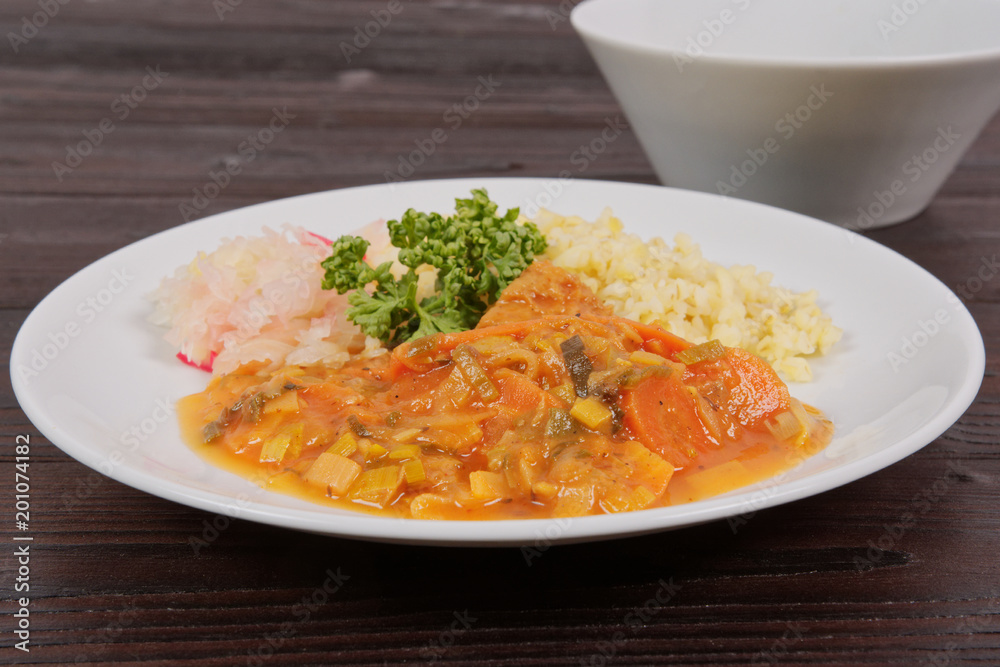 Seitan goulash with bulgur on a table Seitan goulash with bulgur on a table
