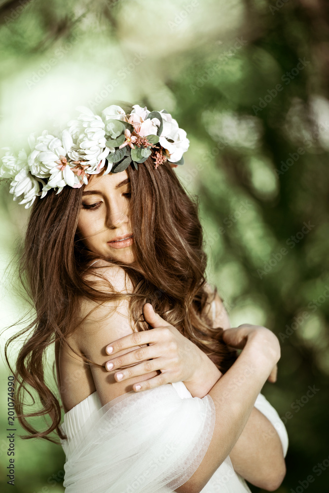 Brunette bride in fashion white wedding dress with makeup