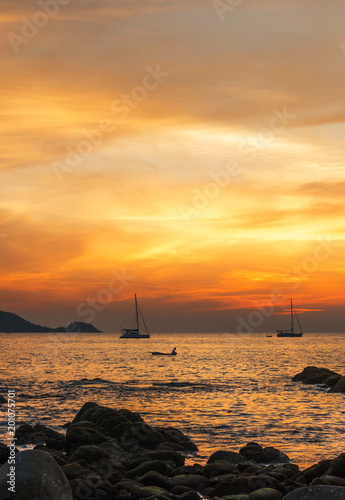 Tropical sunset on the beach,Sunset over a rocky coast,Beautiful Seascape