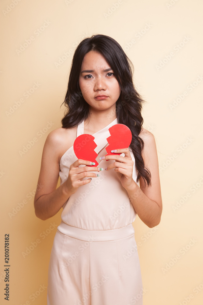 Beautiful young Asian woman with broken heart. Beautiful young Asian woman with broken heart.