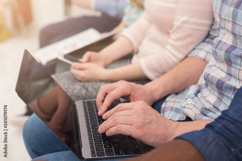 Fototapeta premium Group of unrecognizable people using gadgets