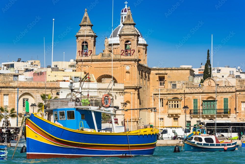 Coloful boats in Marsaxlokk port in Malta