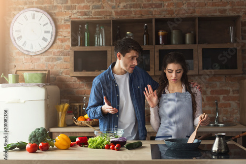Couple cooking healthy dinner together