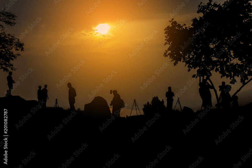 Group travelers stand on find path on the rock silhouette style.