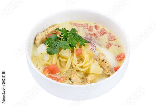 High angle view of Thai food - chicken and noodles in coconut milk soup isolated on white. Delicious soup with meat and noodles.