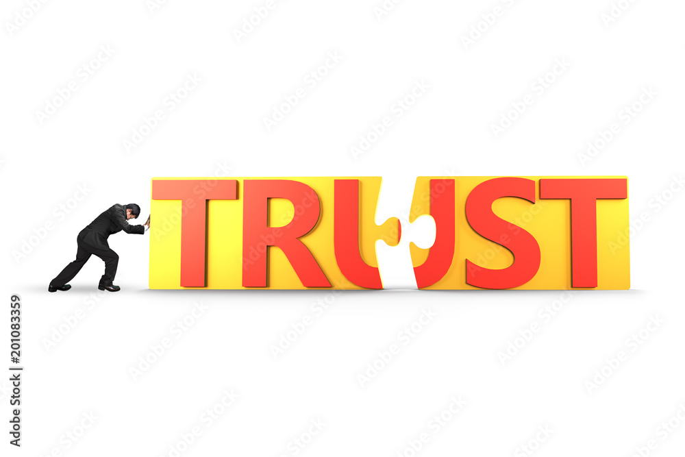 Man push puzzle pieces with word TRUST together