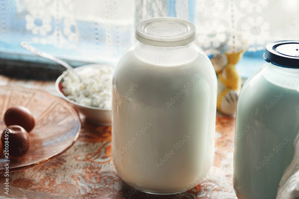 Jar of fresh homemade milk on the table. Rustic style Jar of fresh homemade milk on the table. Rustic style