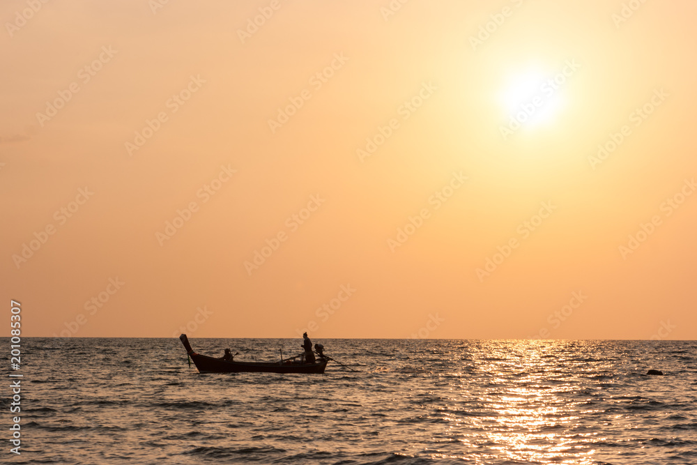 Traditional thai long tail boat at sunset, Long Beach, Ko Lanta, Thailand.