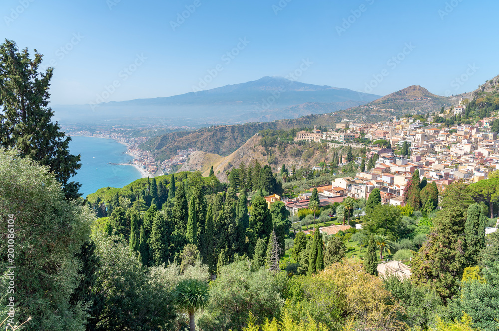 panoramic view of Taormina and Mount Etna, province of Messina, Sicily, Italy