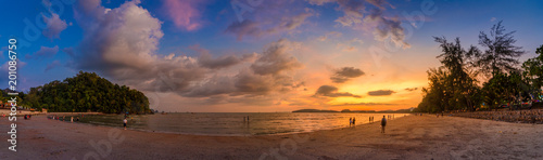 Ao Nang Krabi Thailand The beach has plenty of people in the evening.Golden light Panoramic photo