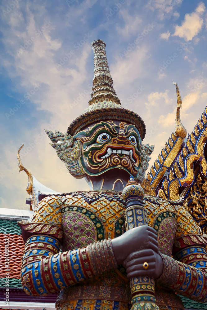Statue of Thotsakhirithon, giant demon (Yaksha) guarding an exit at the Wat Phra Kaew Palace, also known as the Emerald Buddha Temple. Bangkok, Thailand.