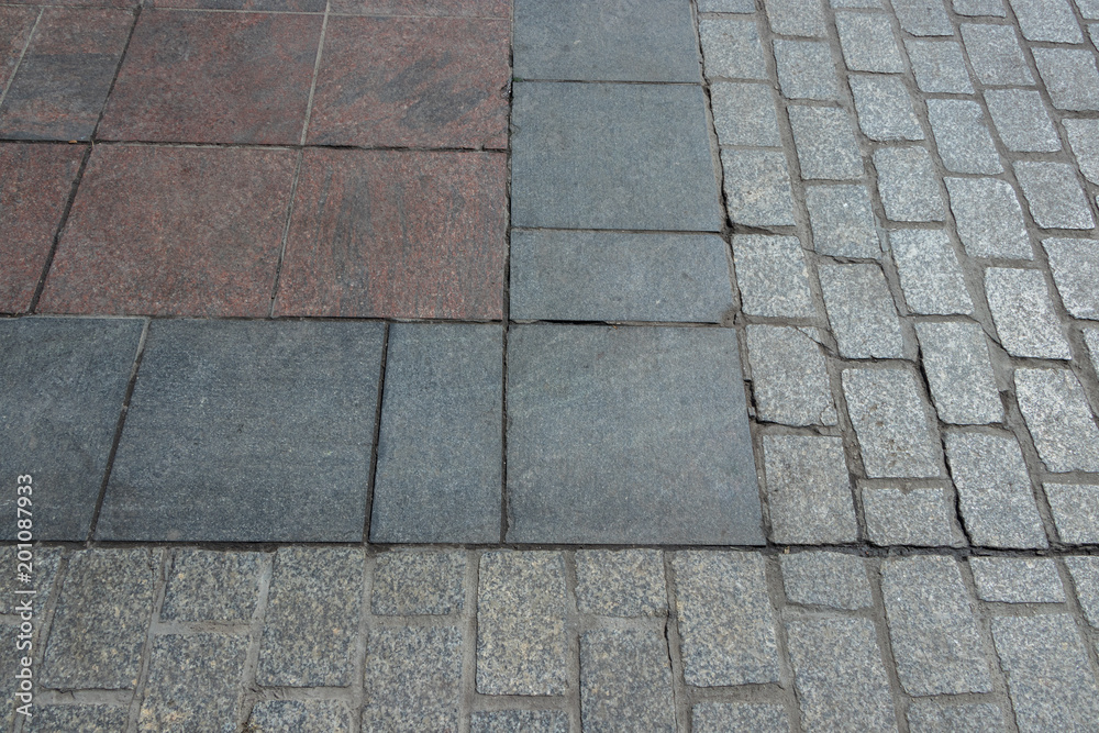 surface with multicolored plates and paving stones