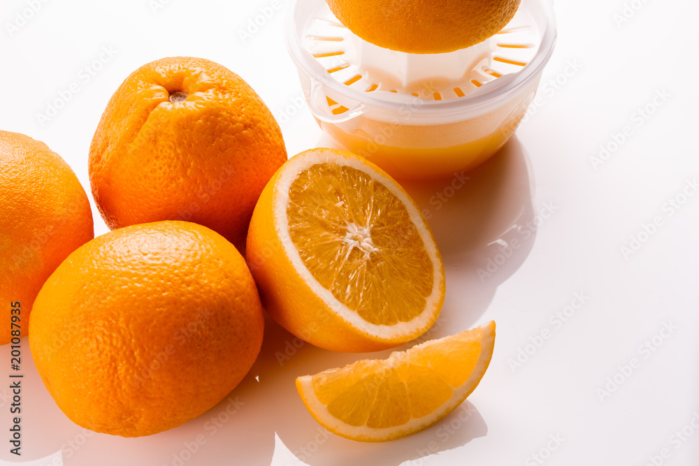 oranges and juice on a white background oranges and juice on a white background