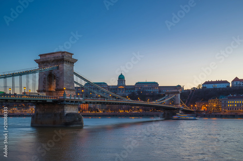 Budapest, Hungary - Beautiful Szechenyi Chain Bridge over River Danube and Buda Castle Royal Palace at blue hour with clear blue sky