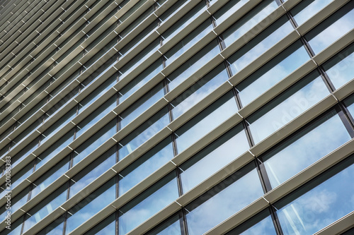 Clouds Reflected in Windows of Modern Office Building