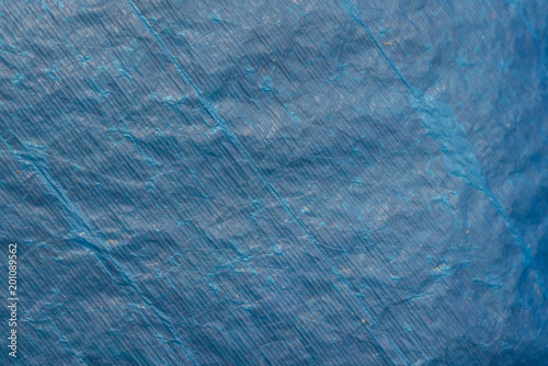 Background texture of blue plastic tarp