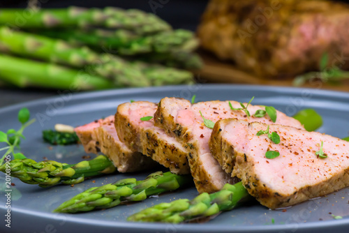 Roasted pork tenderloin and asparagus - close up