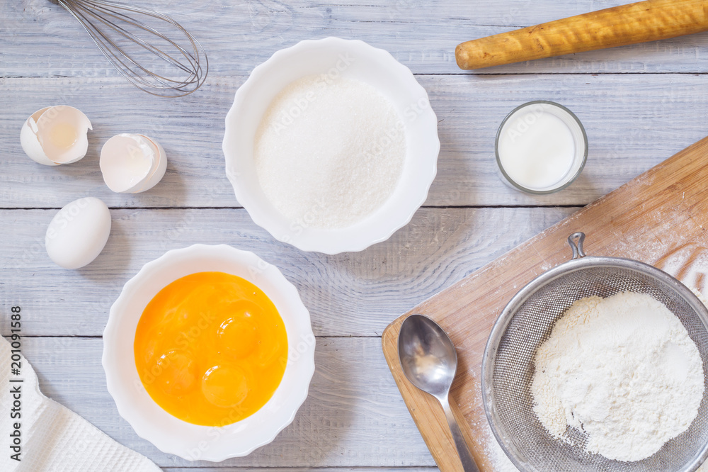 Ingredients for baking on white wooden table Ingredients for baking on white wooden table