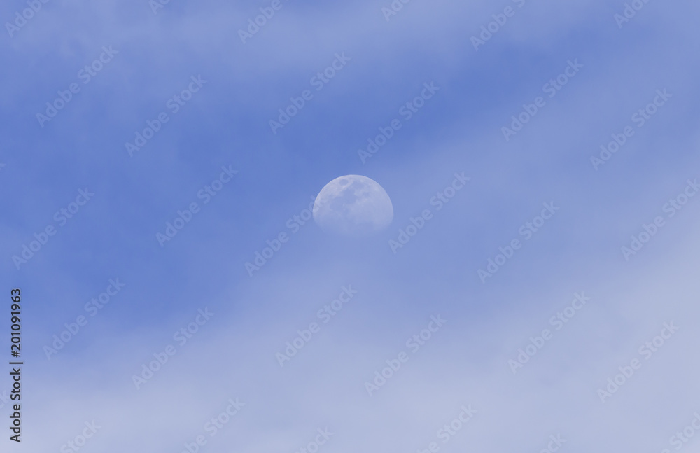 Obraz premium day half moon on the blue sky
