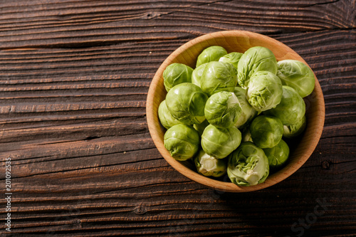Brussels sprouts on a rustic wooden background