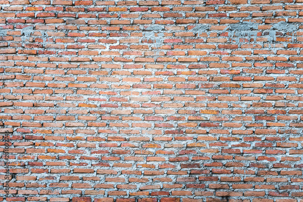 Naklejka premium The wall brick and mortar Brown placed arranged in layers...