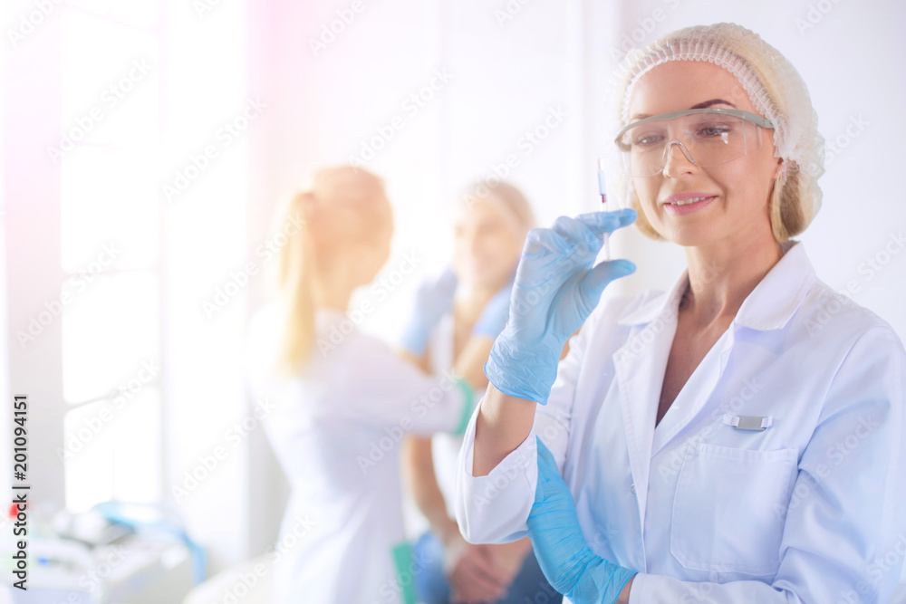 Beautiful woman face near doctor with syringe. Beautiful woman face near doctor with syringe.