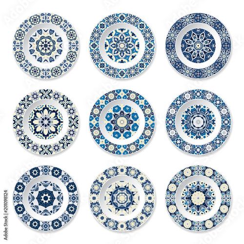 Set of decorative plates with a circular blue pattern, top view. White background. Vector illustration.