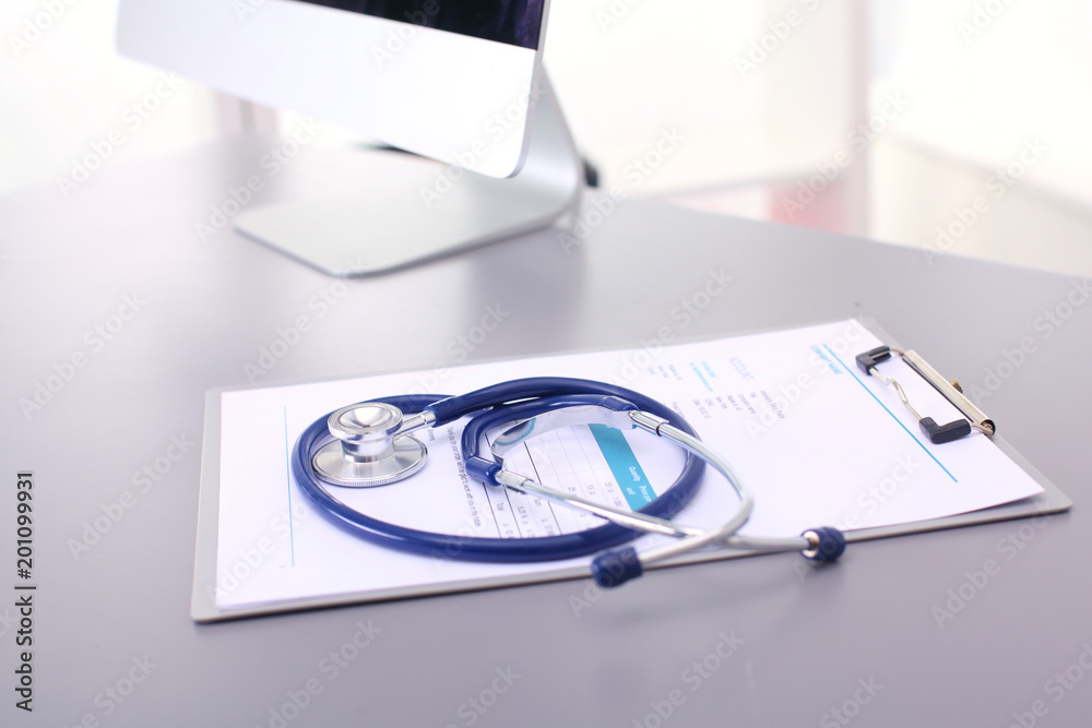Medical equipment: blue stethoscope and tablet on white background. Medical equipment Medical equipment: blue stethoscope and tablet on white background. Medical equipment