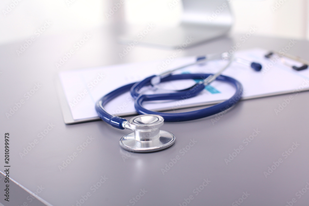 Medical equipment: blue stethoscope and tablet on white background. Medical equipment Medical equipment: blue stethoscope and tablet on white background. Medical equipment