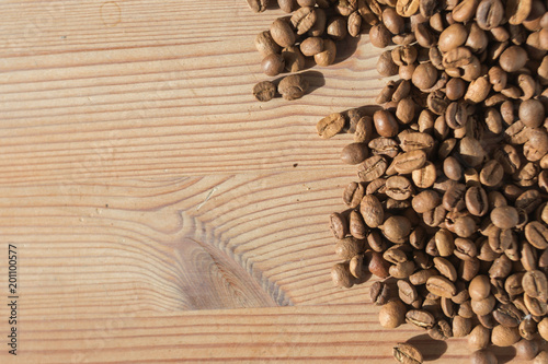 Coffe beans on the wooden background