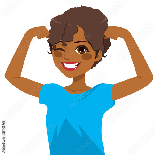 Beautiful young strong powerful African American girl winking eye and showing her muscles with blue shirt