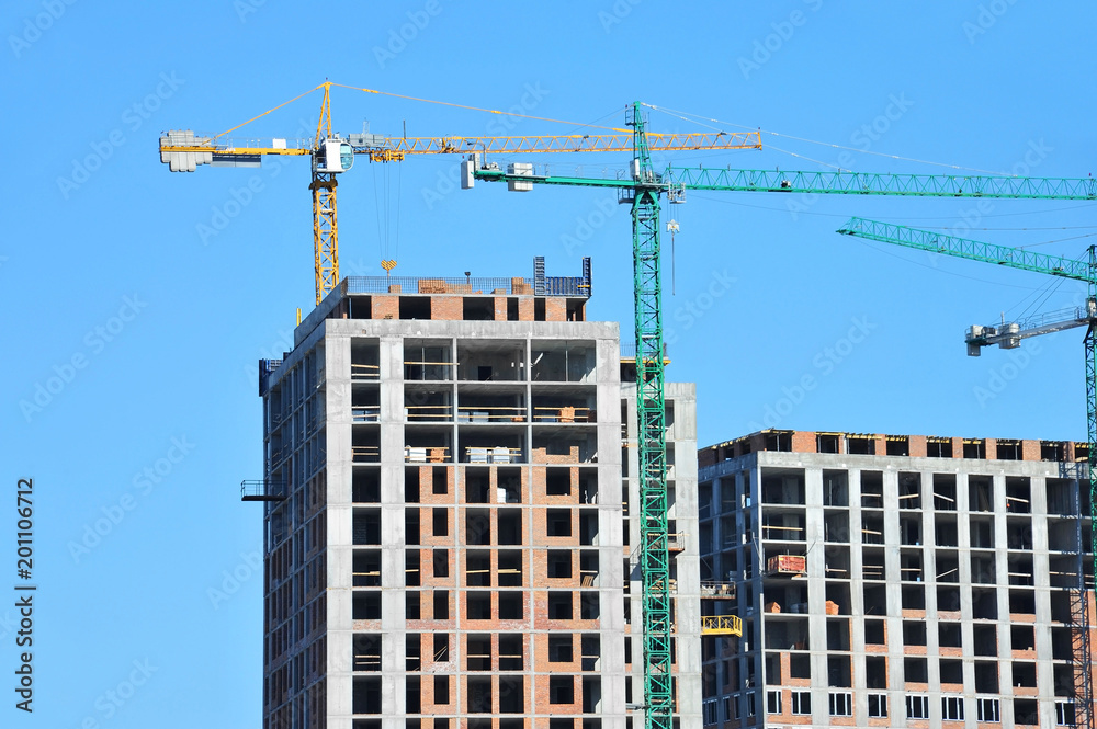 Crane and highrise construction site Crane and highrise construction site