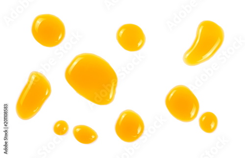 Puddle of orange juice isolated on white background, clipping path with top view