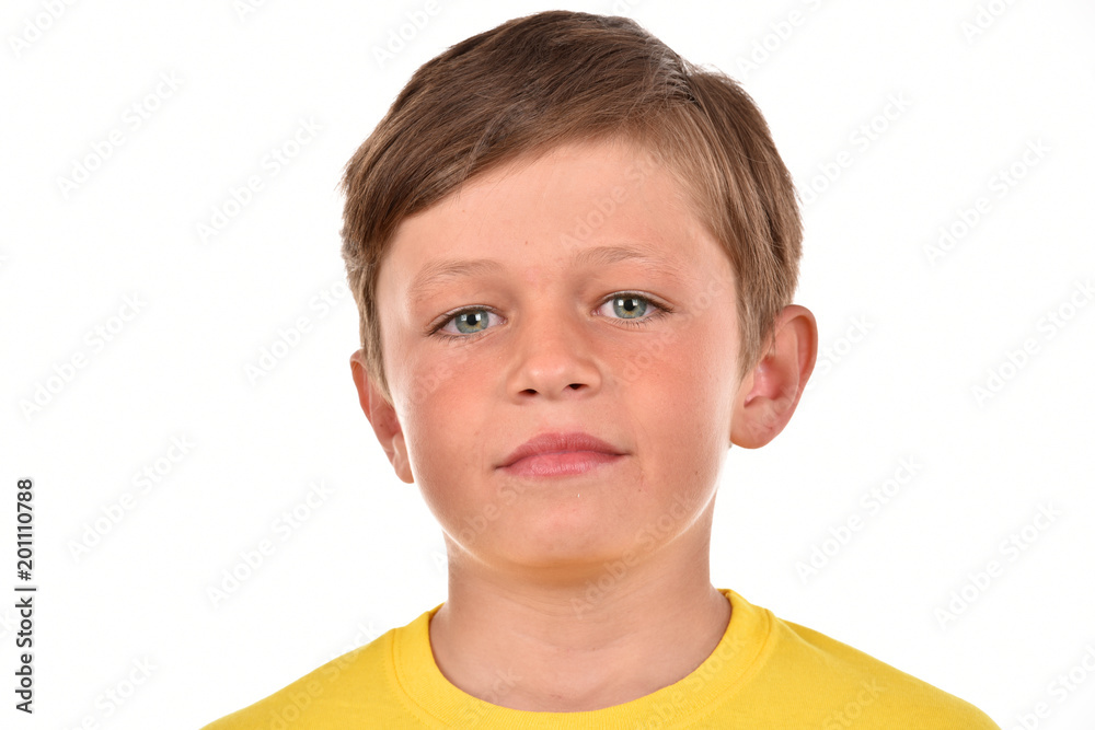 Portrait of a boy on a white background. Emotional child. Studio pictures of a teenager. Portrait of a boy on a white background. Emotional child. Studio pictures of a teenager.