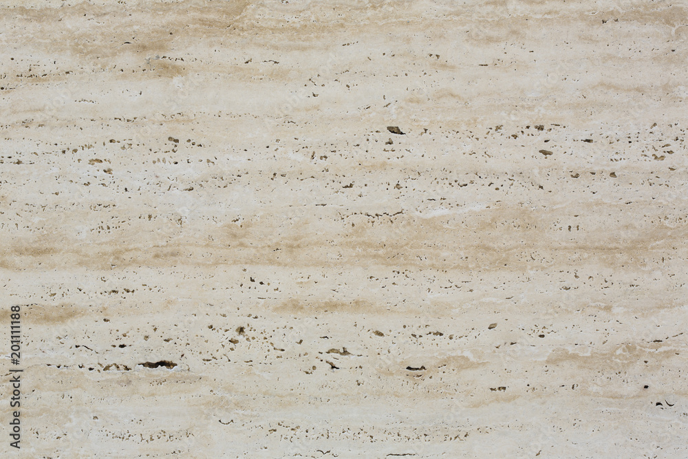 Wall of travertine with stone layers of different colors. Close up architecture macro photography. Creative wallpaper photography.