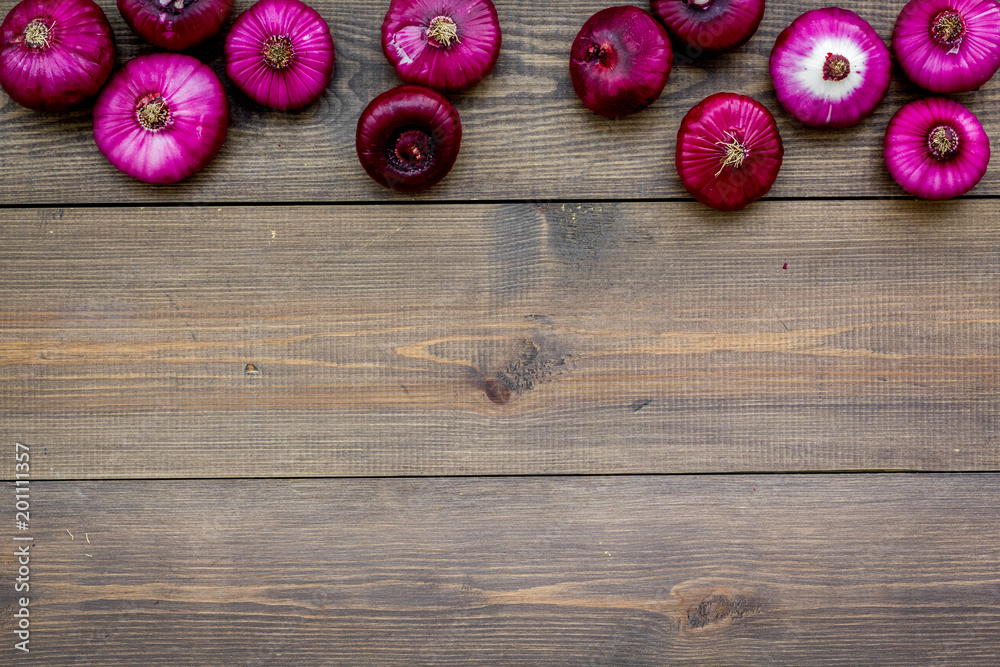 Red onion for salads on dark wooden background top view copy space Red onion for salads on dark wooden background top view copy space