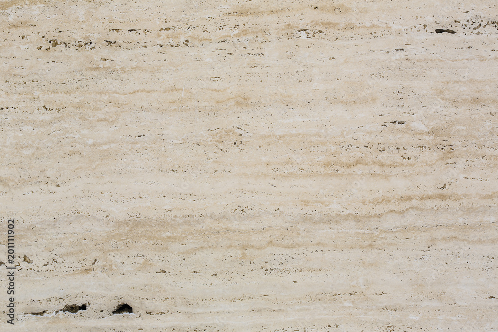 Wall of travertine with stone layers of different colors. Close up architecture macro photography. Creative wallpaper photography.