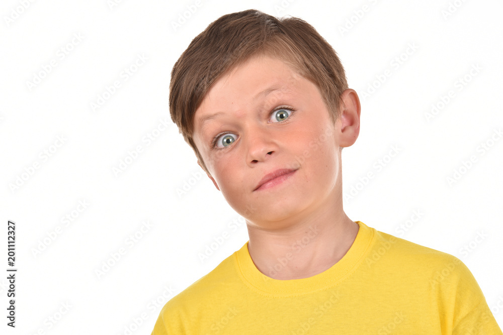 Portrait of a boy on a white background. Emotional child. Studio pictures of a teenager. Portrait of a boy on a white background. Emotional child. Studio pictures of a teenager.
