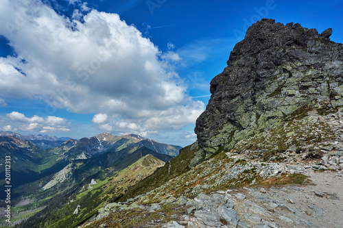 Rocky peaks and clouded sky in the Tatra Mountains in Poland. © GKor