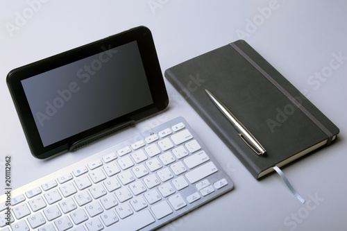 Corporate business desktop with laptop, digital tablet, accessories and work equipment. selective focus.