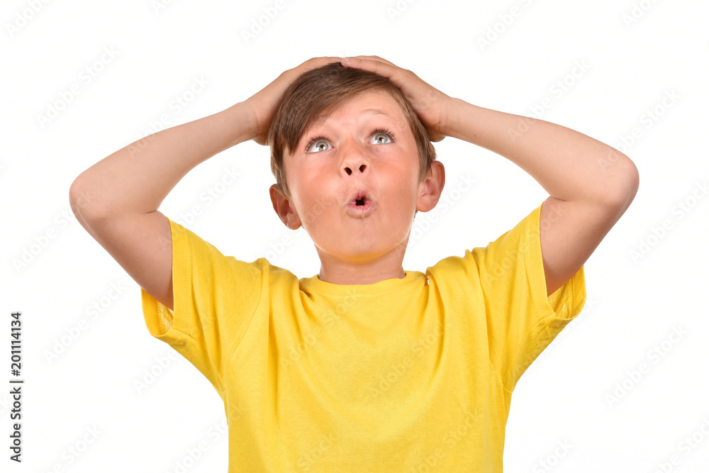 Surprised child. Emotional boy on a white background. Portrait of a teenager. Surprised child. Emotional boy on a white background. Portrait of a teenager.