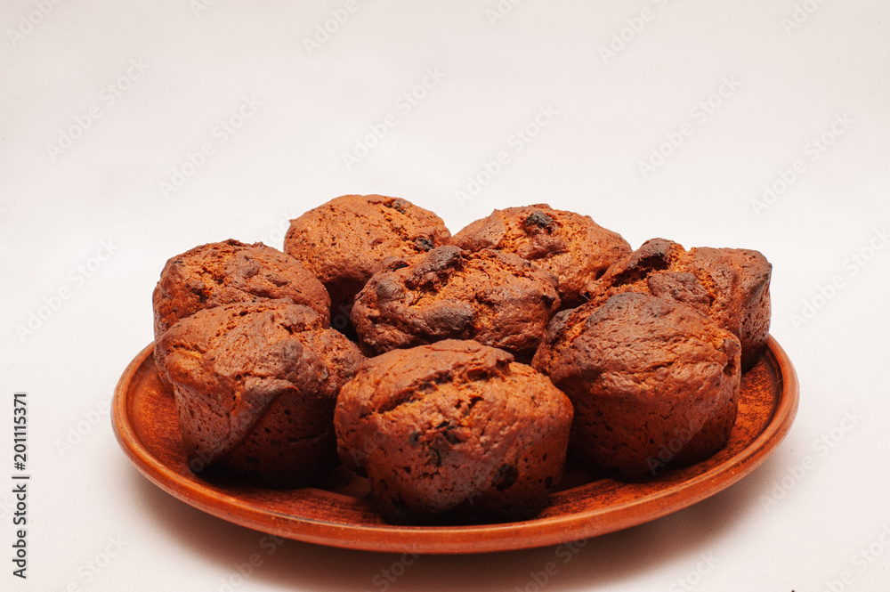 Fototapeta premium Chocolate cupcakes with poppy seeds and raisins