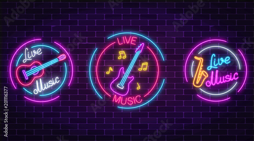 Set of neon live music symbols with circle frames. Three live music signs with guitar, saxophone, notes. photo