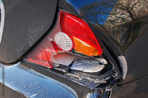 Close-up back of car after the crash. Crashed car needs help for move to the garage to repair and call to loss adjuster for car insurance claim.