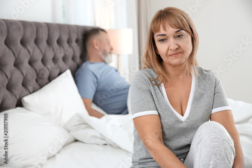 Tableau sur toile Mature couple with problem in relationship on bed at home