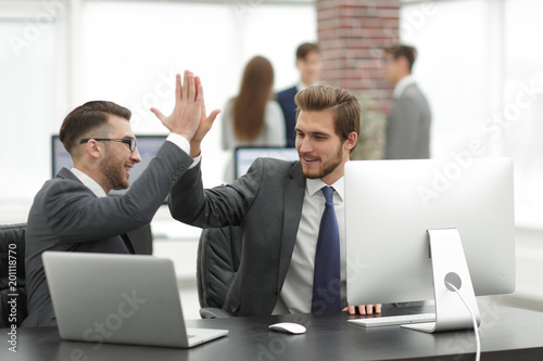 Successfull business people giving High Five for motivation