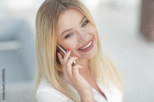 closeup of young woman talking on a mobile phone.