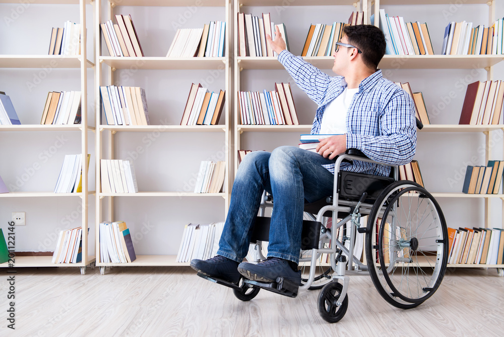 Disabled student studying in the library Disabled student studying in the library
